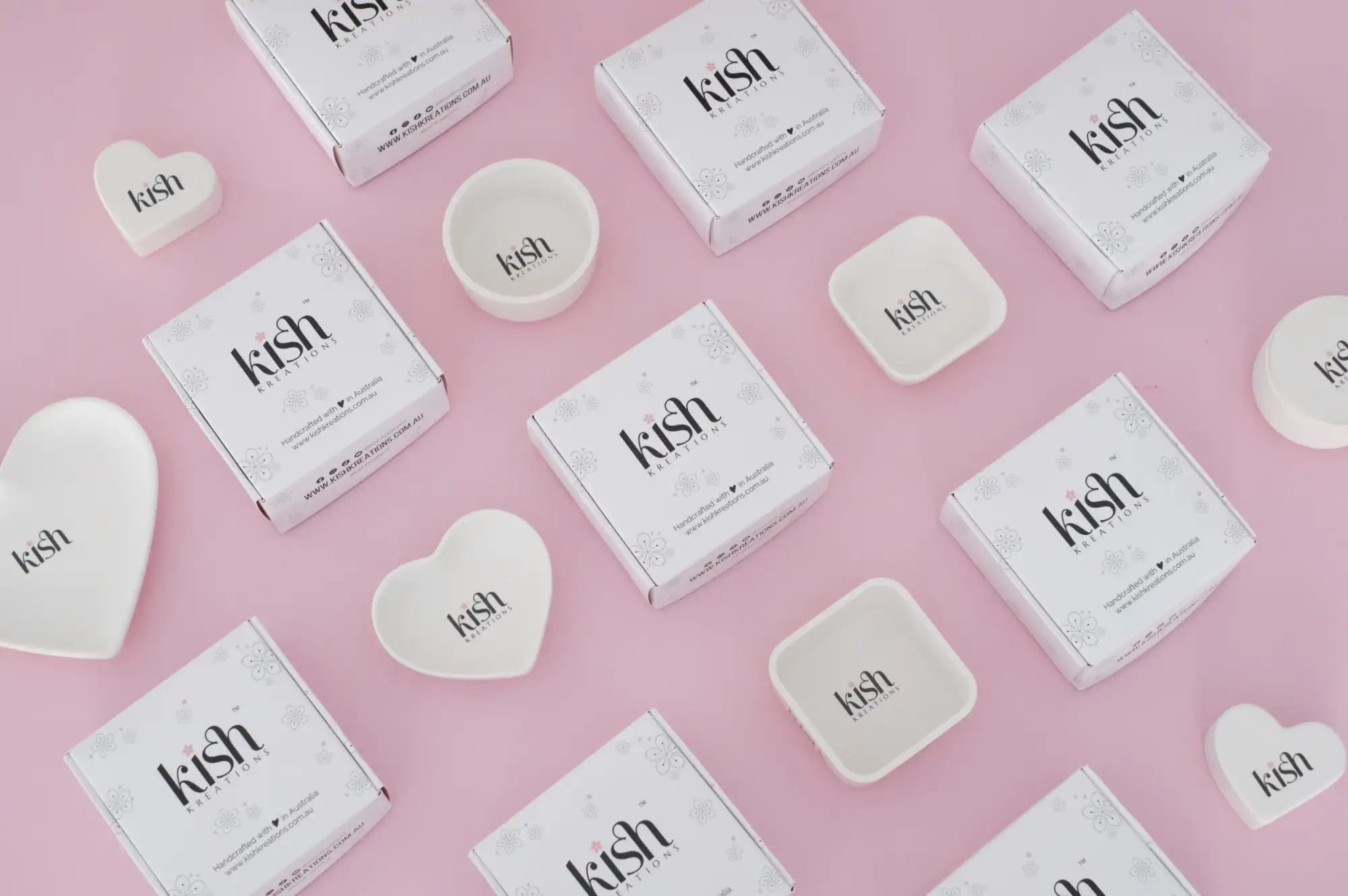 White ceramic heart-shaped and square dishware with ’kish’ branding
